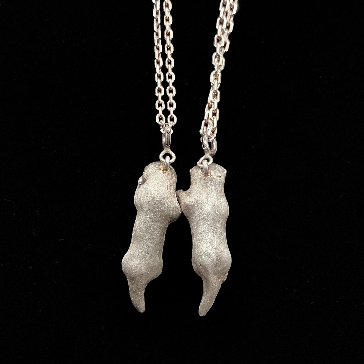 A Pair of Sea Otters Holding Hands Sterling Silver Pendants / Necklaces